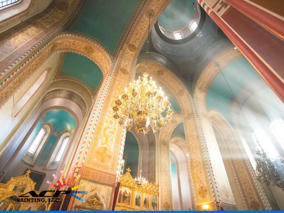 Golden chandelier and arches showcasing vibrant interior church colors in a sacred space.