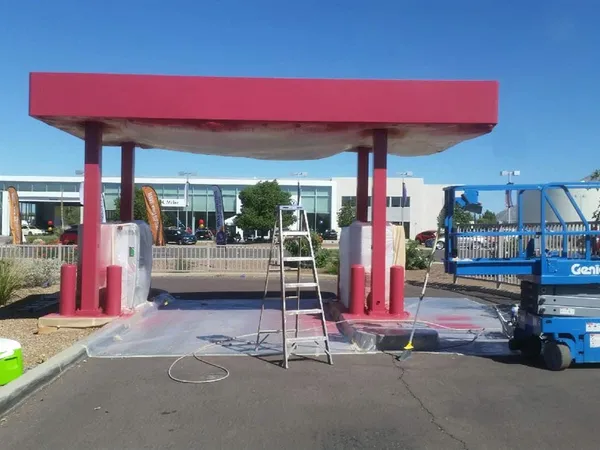 Commercial canopy repainted from a lift by ACP Painting in the Phoenix metro