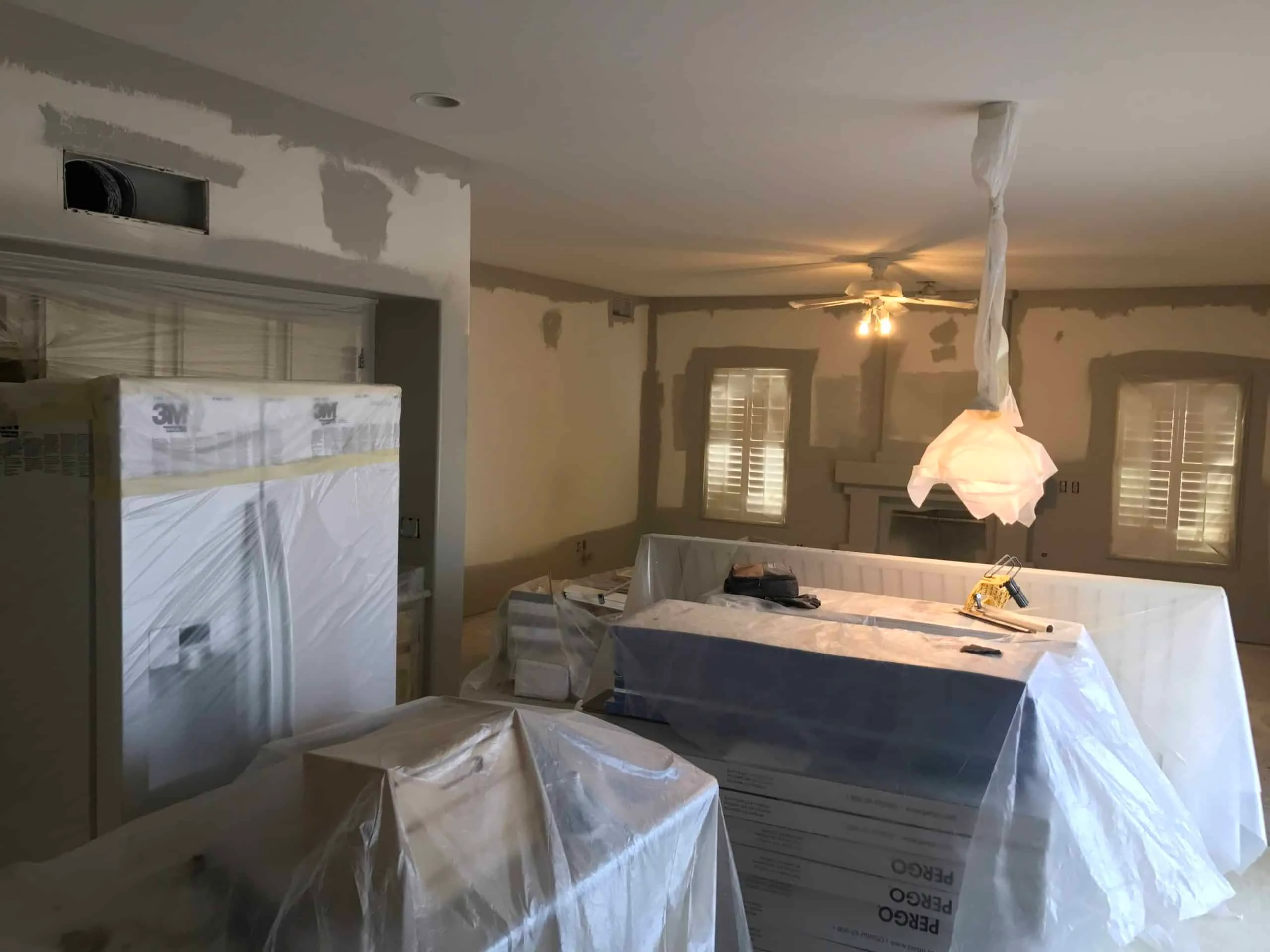 Home appliances and fixtures protected during paint job renovation