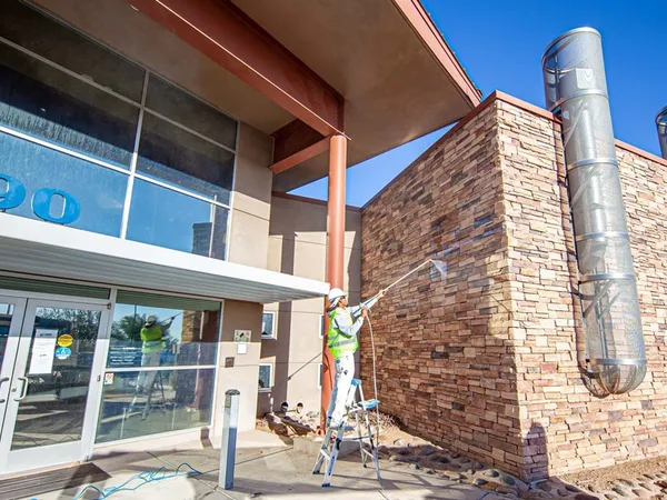 Retail storefront exterior being prepped and repainted by ACP Painting